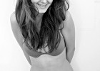 Pretty young female in black and white picture wearing swimsuit bra