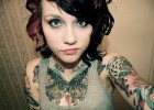Hot emo chick with seductive cleavage and trendy tattoos