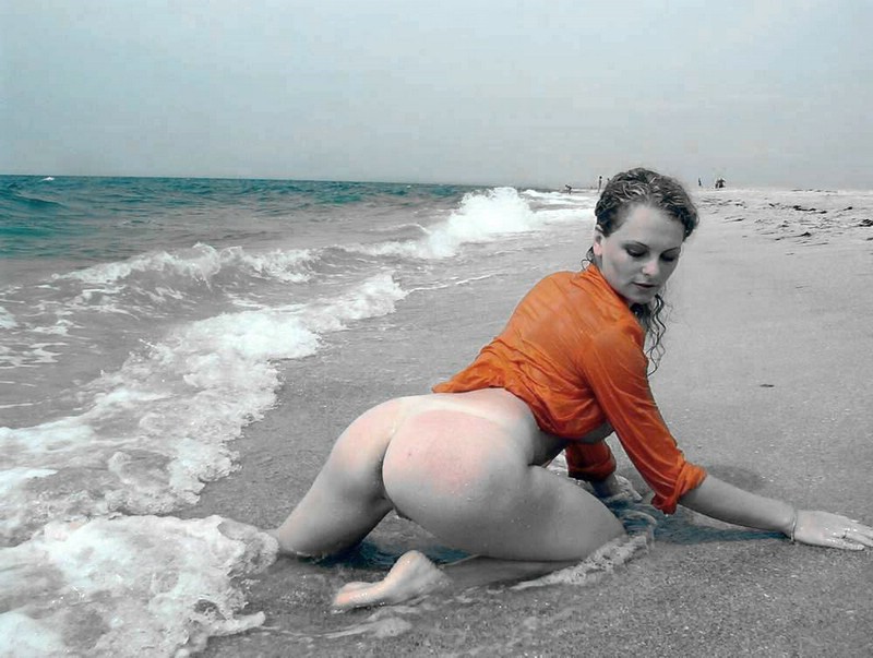 Marvelous woman tempting by the beach as she shows her huge bottom