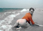 Marvelous woman tempting by the beach as she shows her huge bottom