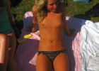 It was a torrid day so she decided to go topless
