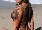 Amazing model with curvaceous body full of tattoos