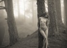 Naked angelic girl lost in forest