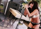 Amateur singer in scant attire with worked body and long dark hair
